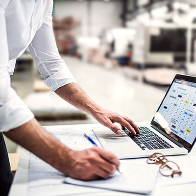 Facilities manager checking air conditioning audit results